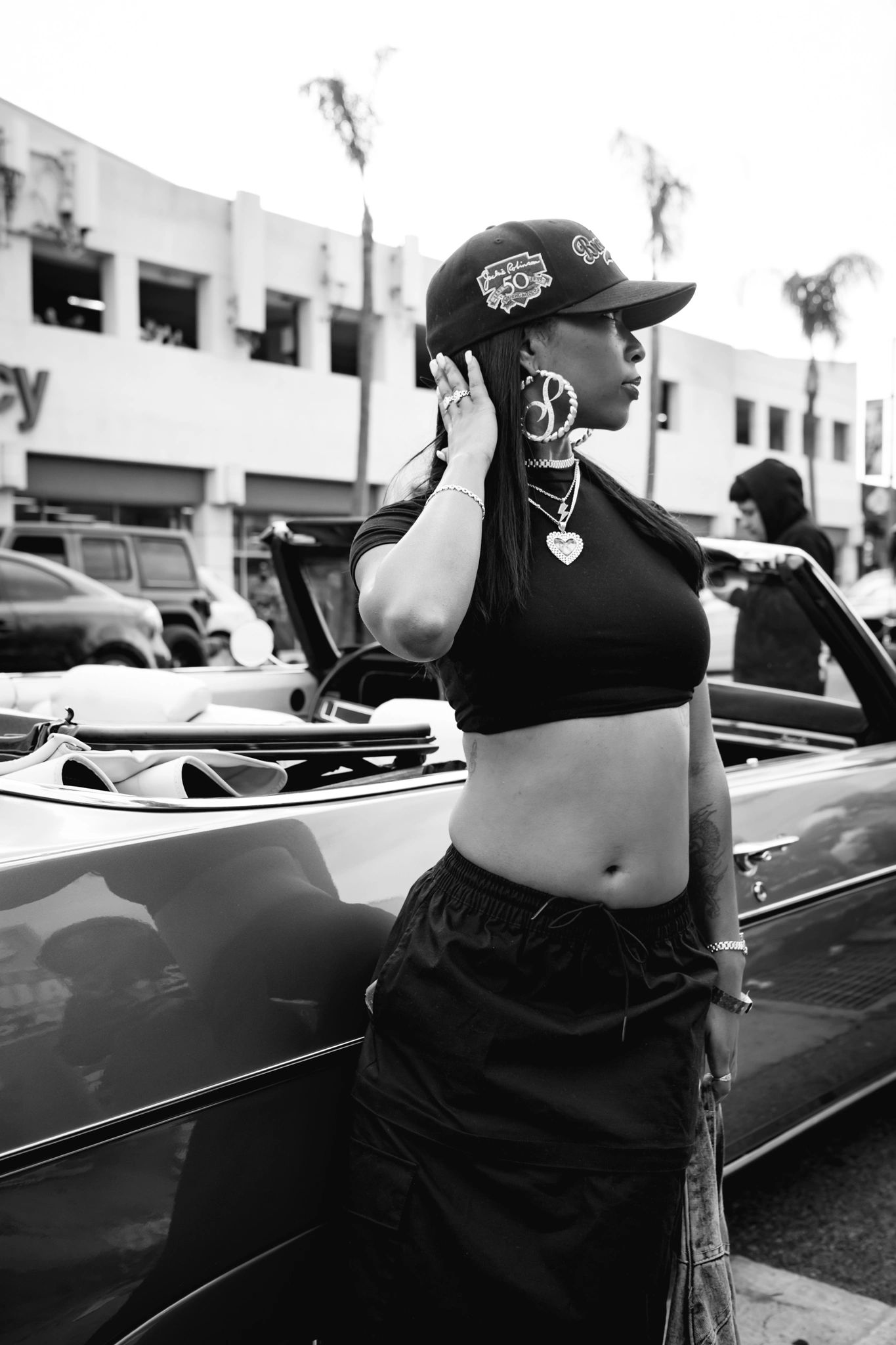 Woman with lowrider car